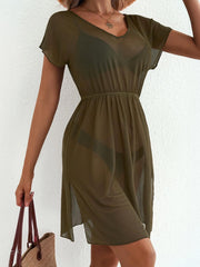 Green sheer mini dress with V-neck, short sleeves, elastic waist, and side slit.