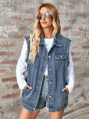 Dusty blue denim utility vest with raw edges and button front.