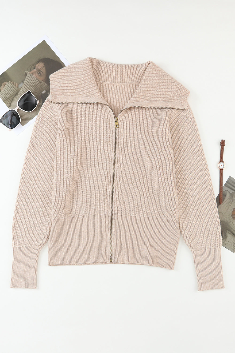 Beige ribbed knit zip-up cardigan with a wide shawl collar and cuffed sleeves.