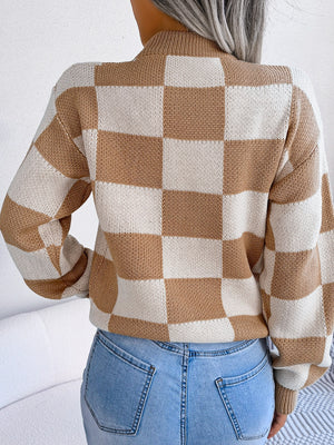 Checkerboard knit mock neck pullover in camel and cream acrylic with long sleeves.