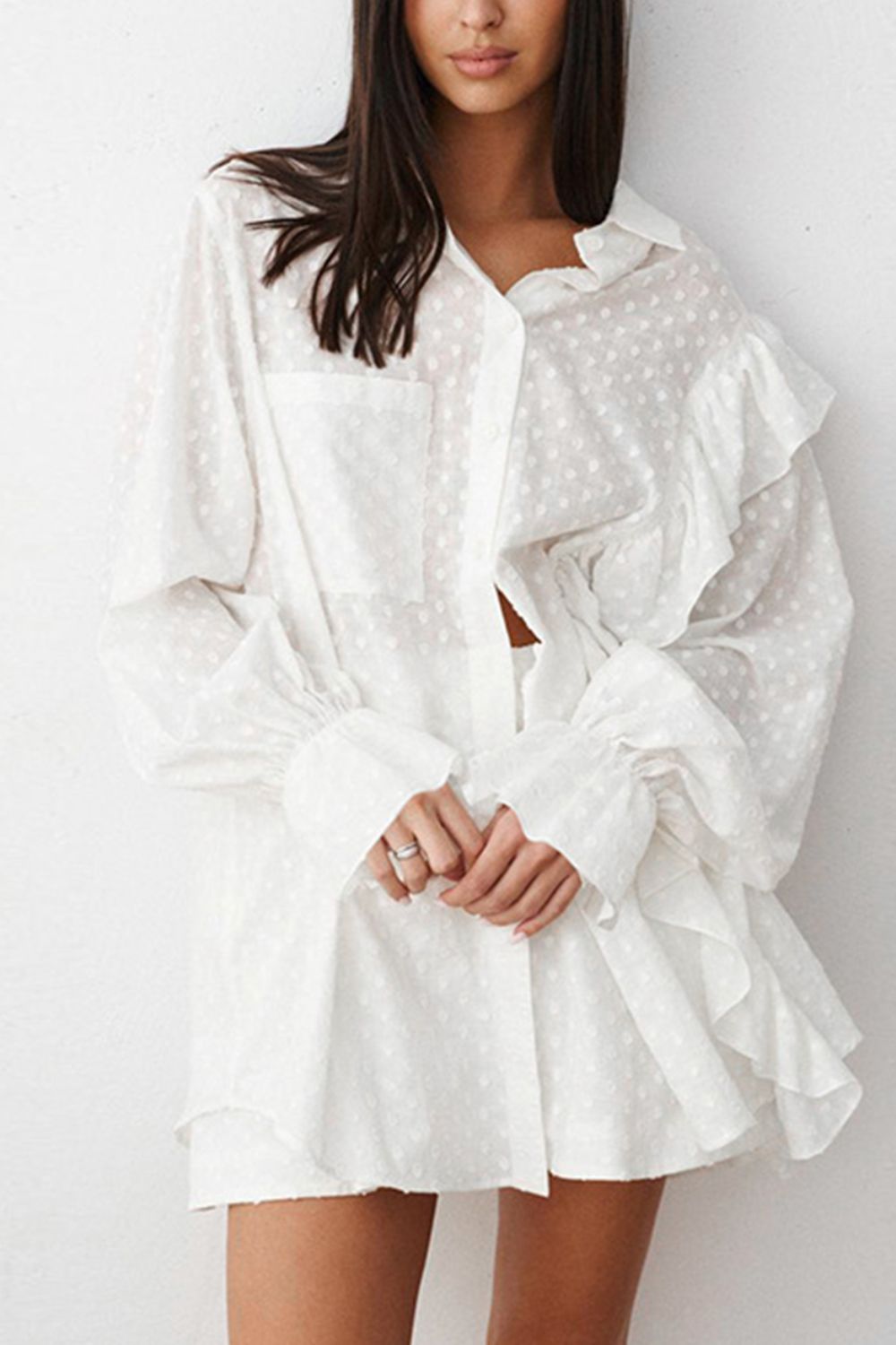 White textured ruffle trim shirt set with collared neckline and balloon sleeves.