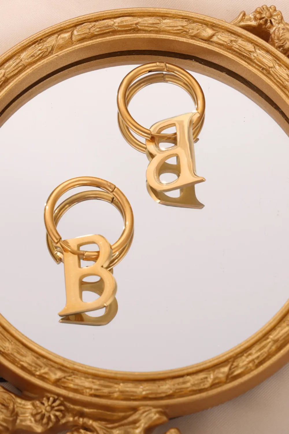 Gold initial letter hoop earrings with B charm