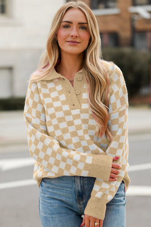Tan and white checkerboard knit polo sweater with button detail.