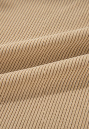 Tan corduroy utility shirt fabric detail with visible ridges.