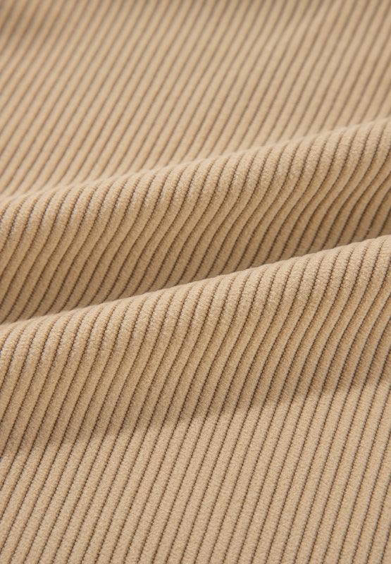 Tan corduroy utility shirt fabric detail with visible ridges.