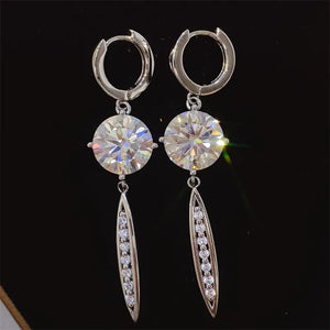 Silver moissanite orb dangle earrings with pavé accents on sterling silver.