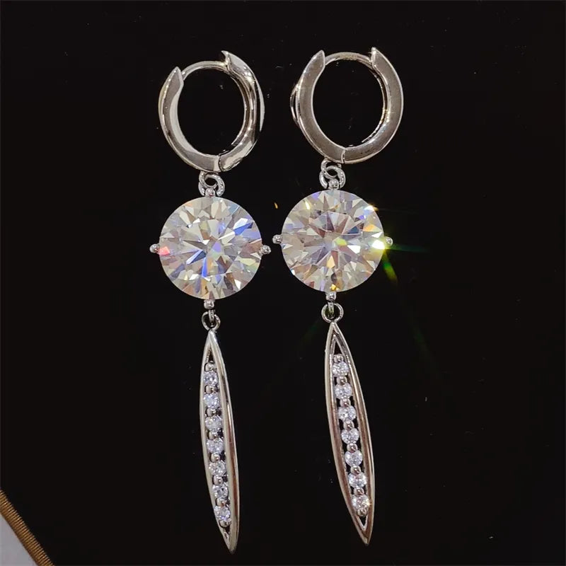 Silver moissanite orb dangle earrings with pavé accents on sterling silver.
