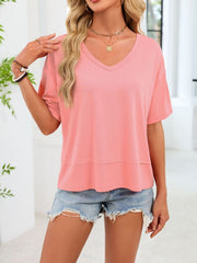Pink relaxed fit v-neck t-shirt with short sleeves and a tiered hem detail.