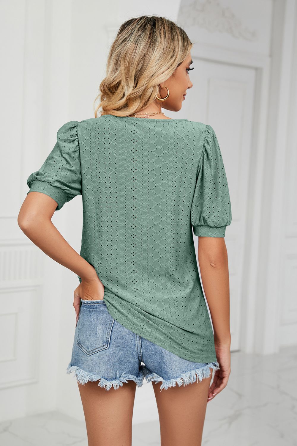 Green eyelet puff sleeve scoop neck blouse with textured pattern