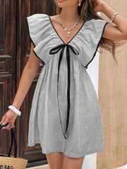 Ruffled sleeve mini dress with black bow and pinstripe pattern.