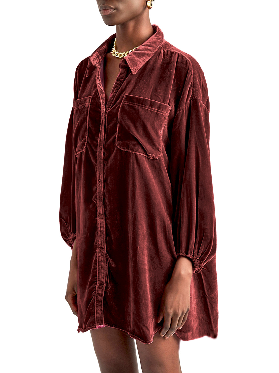 Brown velvet oversized shirt with button front, two chest pockets, and balloon sleeves.