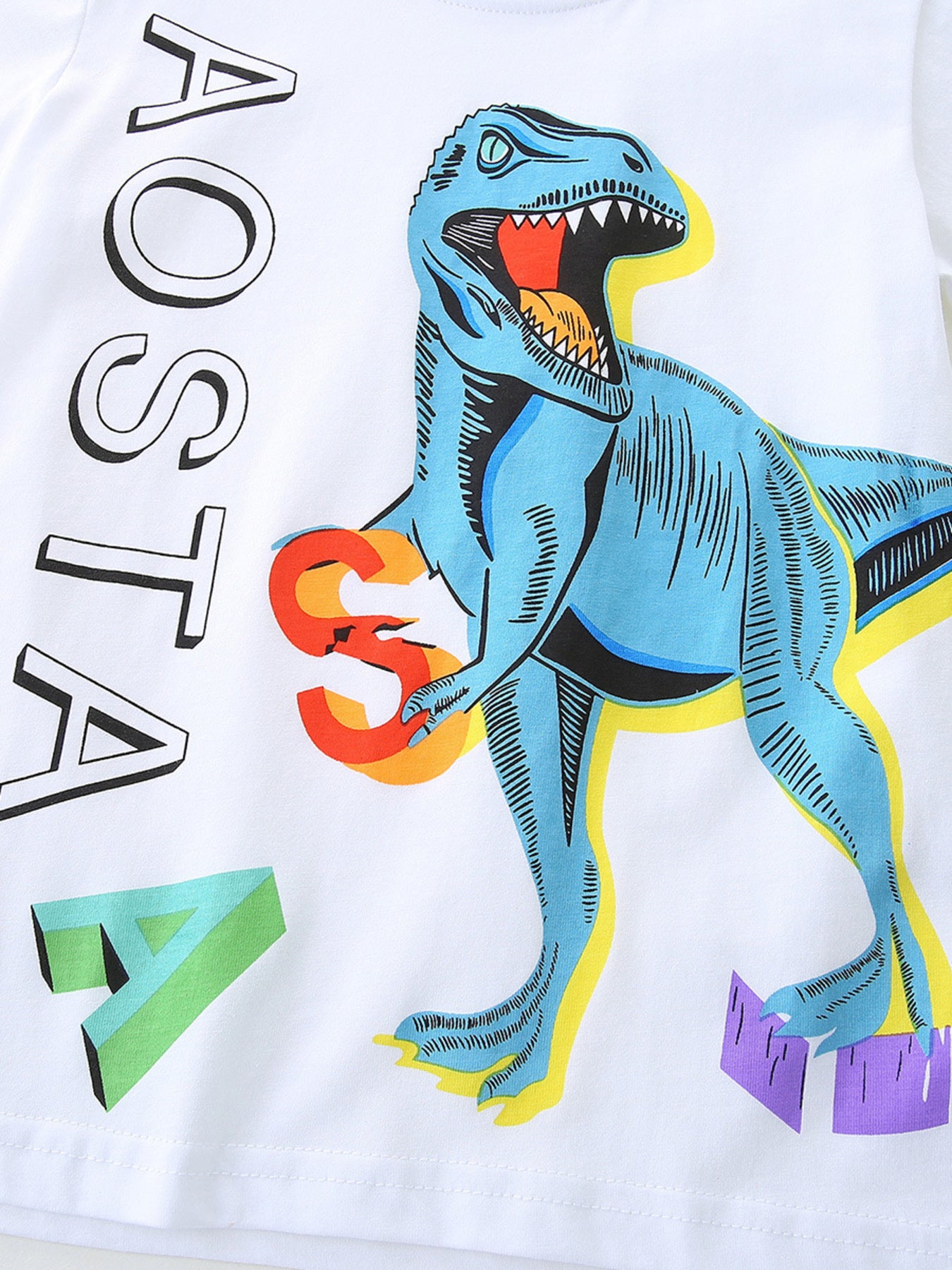 White cotton baby tee with blue dinosaur graphic and colorful letters.