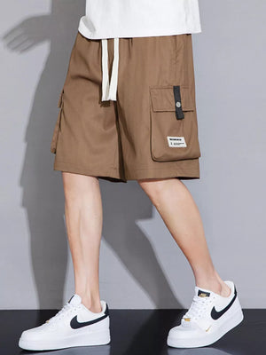 Brown cargo shorts with white drawstring and side pocket detail.