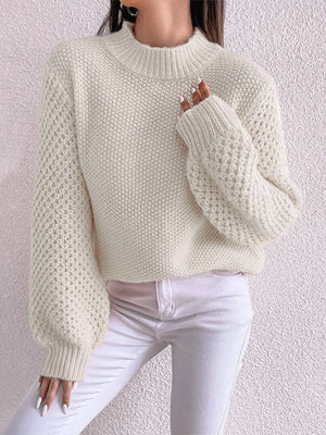 Cream textured puff sleeve mock neck knit sweater with waffle stitch detail.