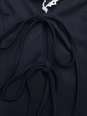 Navy vest with lace trim and adjustable tie-front detail