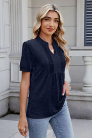 Dark navy pleated yoke henley tee with short sleeves and a keyhole neckline.