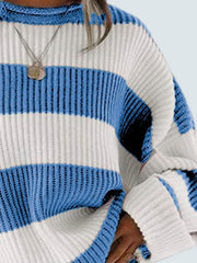 Striped oversized knit sweater in blue and white with a crew neck and ribbed details.