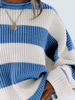 Striped oversized knit sweater in blue and white with a crew neck and ribbed details.