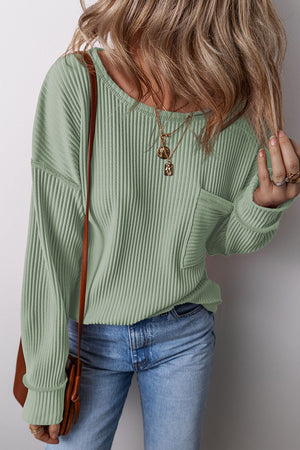 Sage ribbed knit long sleeve top with a patch pocket and crew neck.