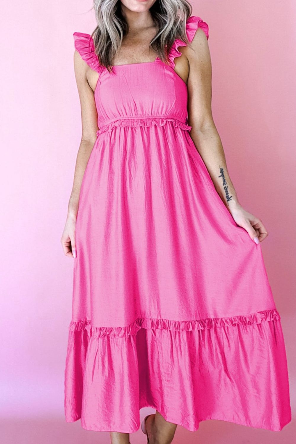 Ruffled sleeveless pink maxi dress with smocked waist and tiered hem