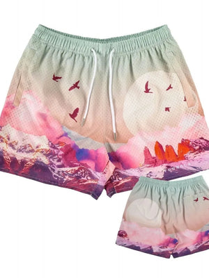 Mesh athletic shorts with a mountain and bird print in pink, purple, and blue.