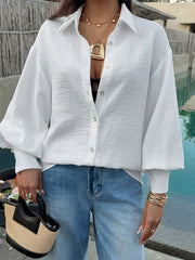 White crinkled button-up shirt with lantern sleeves and classic collar.