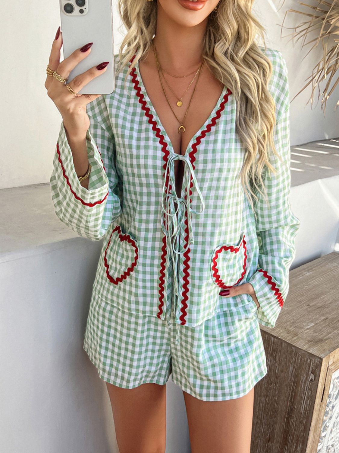 Light green gingham lounge set with red trim and heart pockets, tie-front top and shorts.