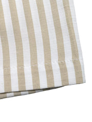 Chic striped two-piece set in beige and white cotton with visible stitching detail.