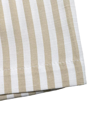 Chic striped two-piece set in beige and white cotton with visible stitching detail.