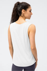 White athletic tank top with rounded neckline and sleeveless design.