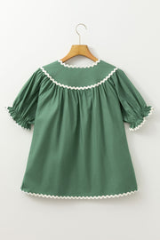 Moss green blouse with puff sleeves and scalloped trim neckline and cuffs.