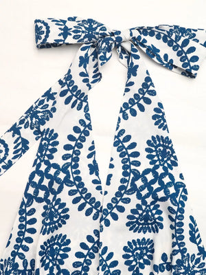 Blue and white medallion print halter maxi dress with a tie neck.