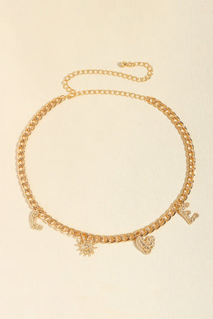 Gold chain belt with charms including letters L, E, a sun, and a heart.