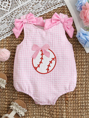 Pink gingham baby one-piece with baseball embroidery and polka dot bows on shoulders.