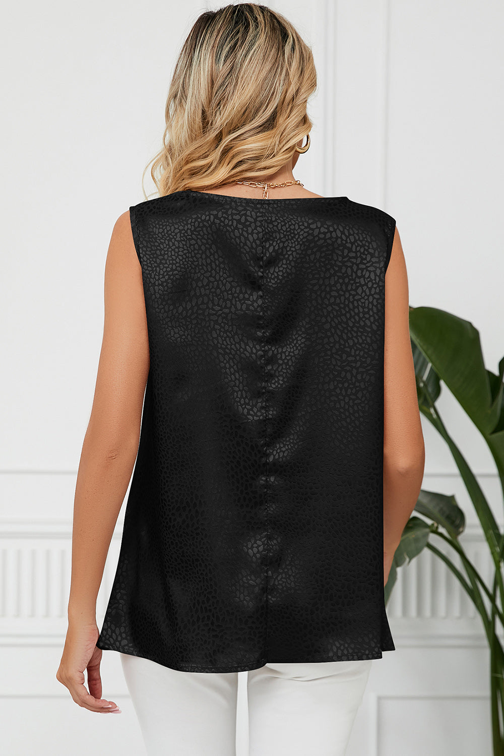 Black jacquard tank top with drape neckline and subtle animal print pattern.