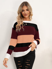 Colorblock crewneck sweater in acrylic with horizontal stripes of burgundy, peach, black, and white.