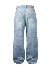 Embellished wide-leg denim trousers in medium wash with all-over sparkle details.