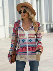 Aztec print zip-up hooded jacket with pockets in pink, blue, and tan.