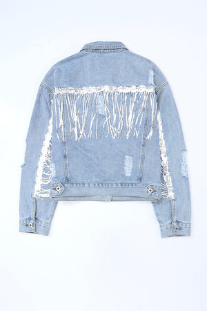 Denim trucker jacket with sequin fringe and distressed details.