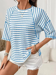 Light blue and white wavy stripe knit t-shirt with relaxed fit and crew neck.