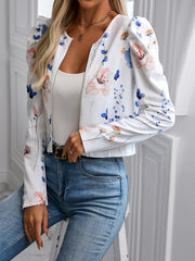 White floral puff sleeve cropped zip jacket with a round neckline.