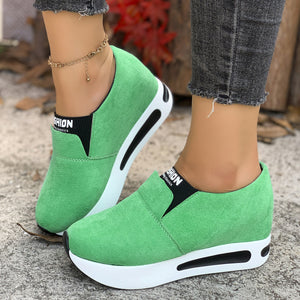 Green round toe platform slip-on sneakers with white soles and black accents.