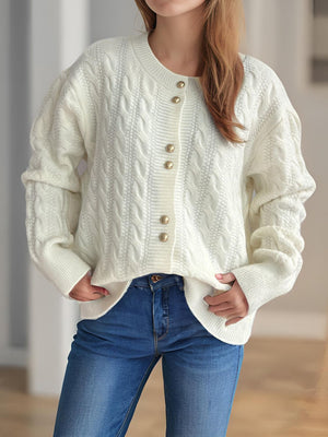 White cable knit puff sleeve cardigan with gold buttons and crew neck.