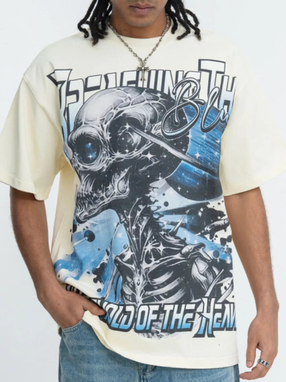 Beige graphic t-shirt with bold skull and text print, short sleeves, crew neck.