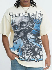 Beige graphic t-shirt with bold skull and text print, short sleeves, crew neck.