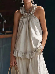 Apricot ruffled halter neck top and wide-leg pants set with frill details.