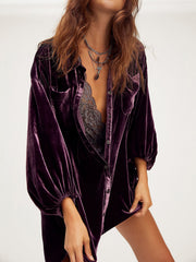Velvet oversized shirt in deep purple with button front and balloon sleeves.