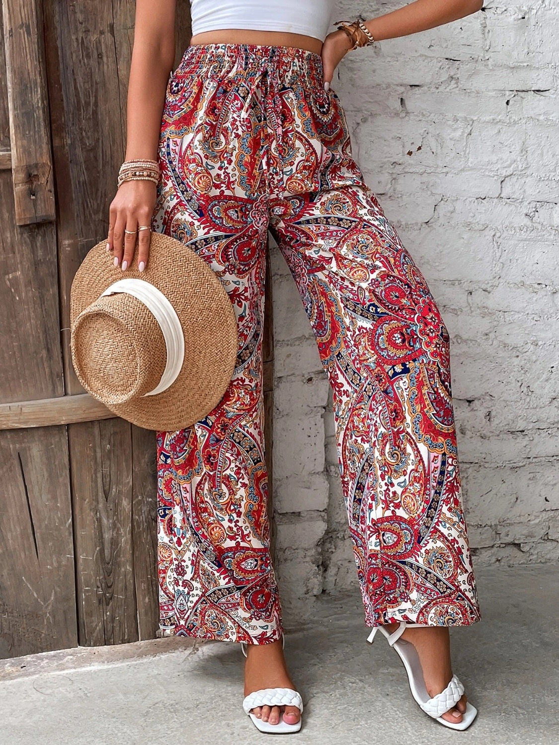 Paisley palazzo trousers in multicolor with drawstring waist and wide legs.