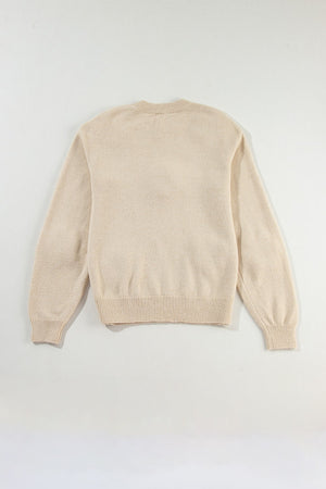 Tan knit sweater with crew neck and ribbed cuffs and hem.
