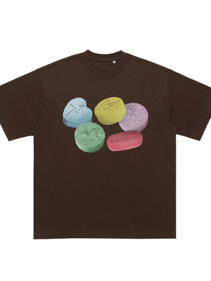 Brown cotton crew neck t-shirt with graphic print of colorful pills and text.